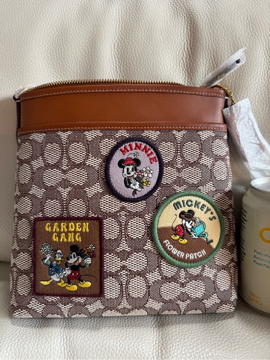 Coach Handbags - Coach Brown Canvas Messenger Bag with Disney Embroidered Patches